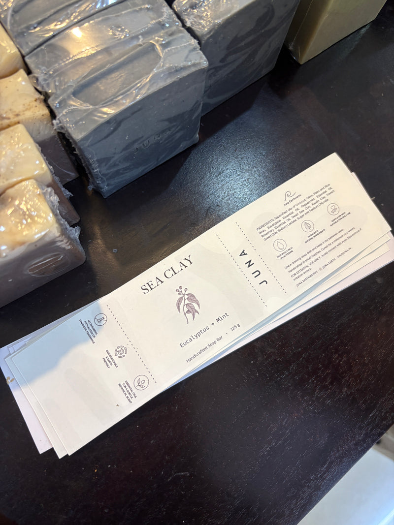 Wrapping finished Juna soap bars by hand